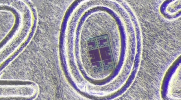 A microrobot is placed on top of a penny to show just how small it is