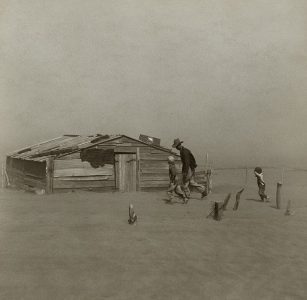 Farmer walking in dust storm Cimarron County Oklahoma
